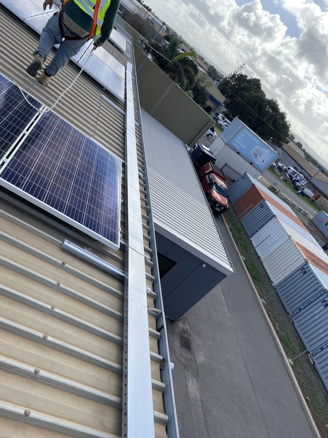 Veeka Power Group installer on a commercial rooftop, Western Australia